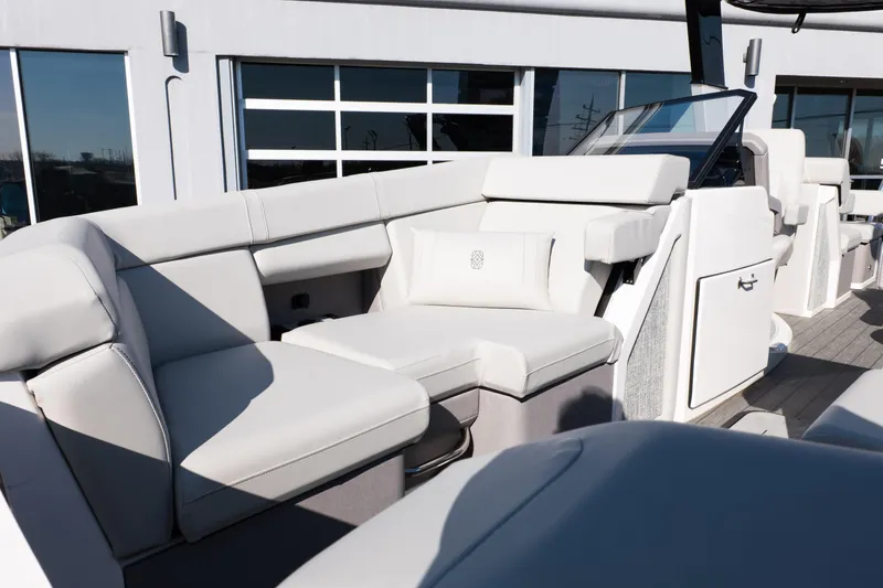 Slide: The Image of Luxurious seating on 2025 Balise Helix 24C boat, featuring sleek white upholstery. - 26