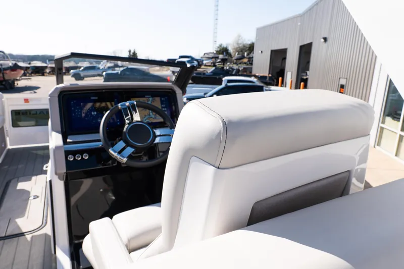 Slide: The Image of Interior view of 2025 Balise Helix 24C boat cockpit with modern steering wheel. - 31
