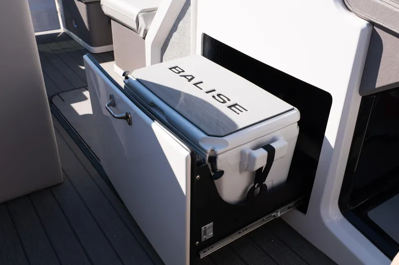 Slide: The Image of Built-in cooler on Balise Helix 24C boat, 2025 model, with sleek design and storage compartment. - 36
