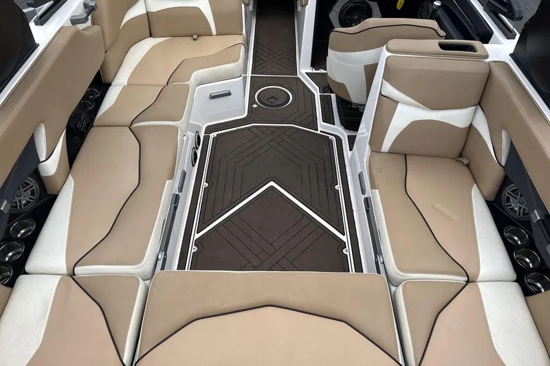 Slide: The Image of 2018 Supra SA 550 boat interior with beige and white seating, modern design. - 10