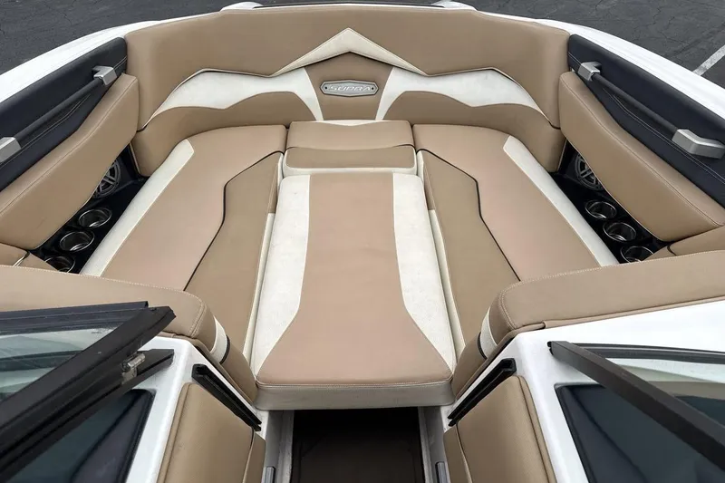 Slide: The Image of Luxurious interior of 2018 Supra SA 550 boat with beige and white seating. - 11