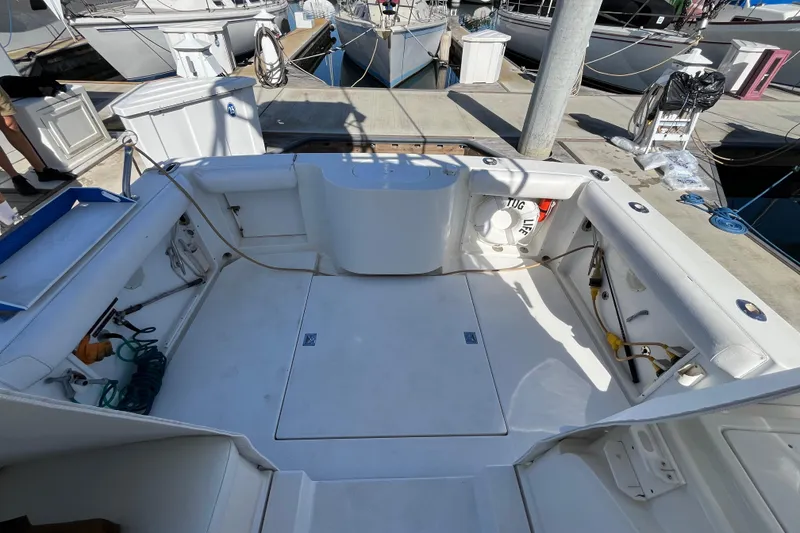 Slide: The Image of Spacious deck of a 1998 Phoenix 32 Tournament boat docked at a marina. - 10