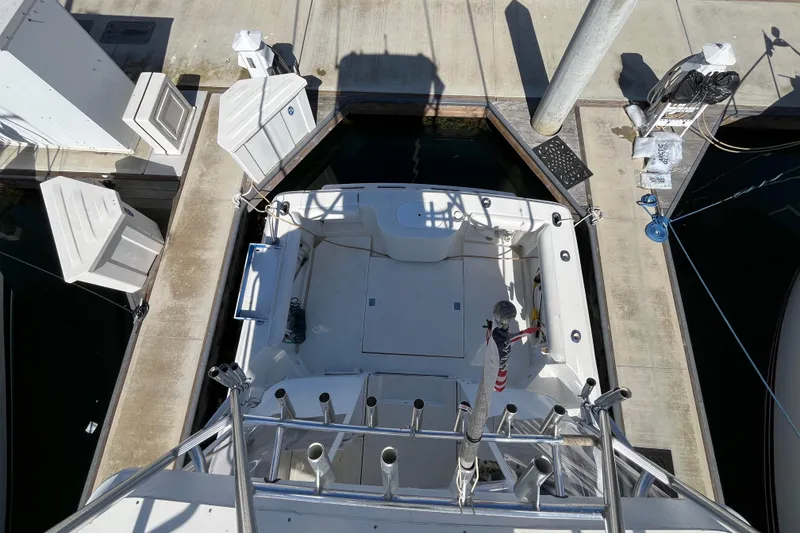 Slide: The Image of Overhead view of a 1998 Phoenix 32 Tournament boat docked at a marina. - 11