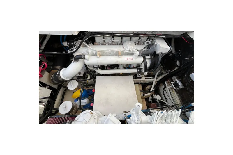 Slide: The Image of Engine compartment of a 1998 Phoenix 32 Tournament boat, showcasing mechanical components. - 24
