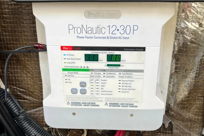 Slide: The Image of ProNautic 12:30P charger on 1998 Phoenix 32 Tournament boat, displaying system output levels. - 29
