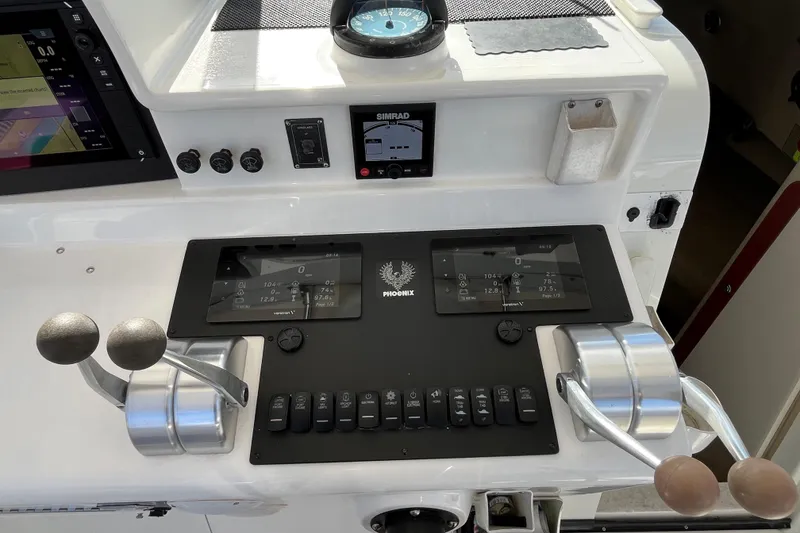 Slide: The Image of Control panel of a 1998 Phoenix 32 Tournament boat with navigation instruments. - 4
