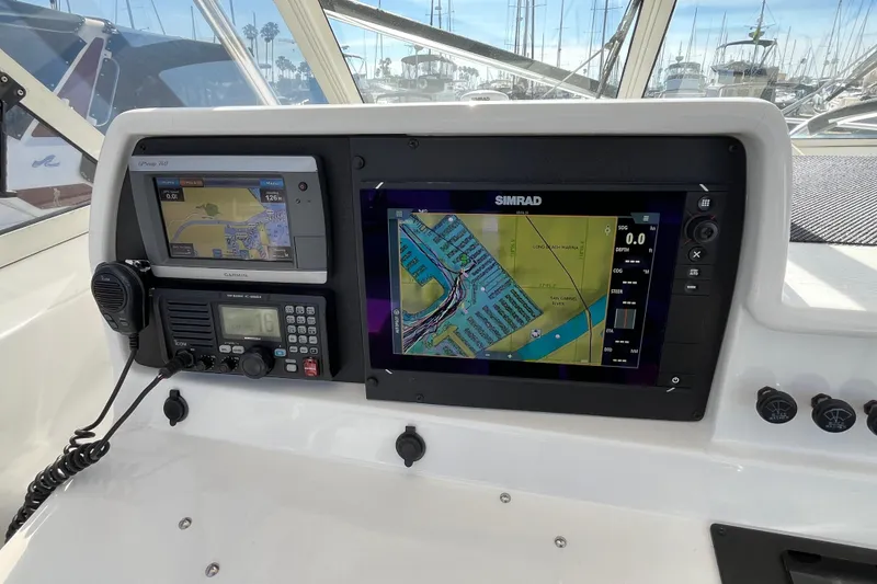 Slide: The Image of Dashboard of a 1998 Phoenix 32 Tournament boat with navigation equipment. - 5