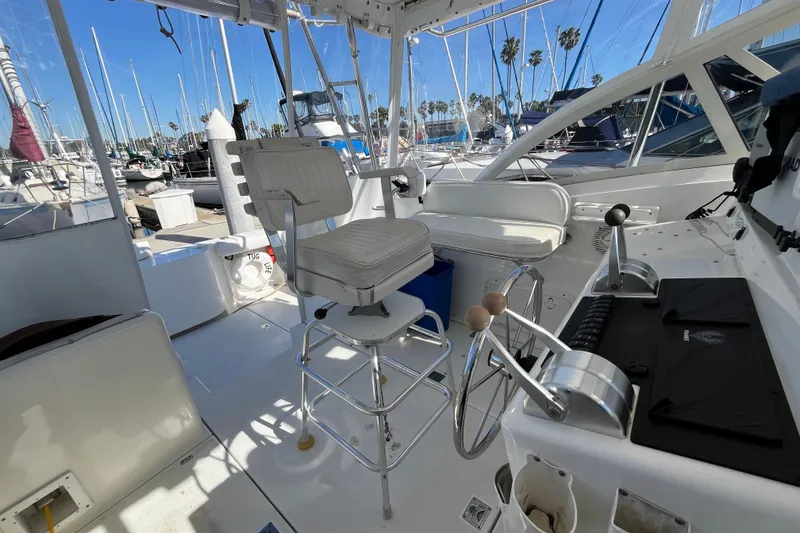 Slide: The Image of Interior of a 1998 Phoenix 32 Tournament boat with helm and seating area. - 6