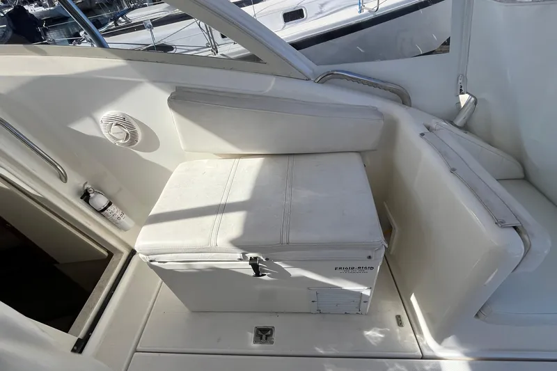 Slide: The Image of Interior of a 1998 Phoenix 32 Tournament boat with seating and storage. - 7