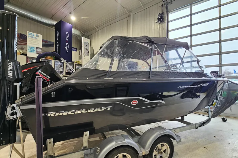 The Image of 2019 Princecraft Platinum SE 227 boat on trailer in showroom. - 0