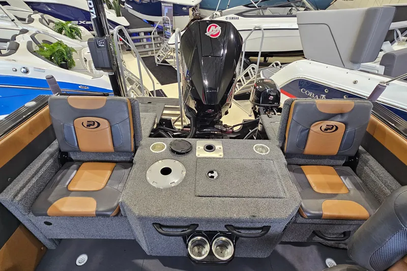 Slide: The Image of 2019 Princecraft Platinum SE 227 boat interior with seating and motor, showcasing luxury design. - 12