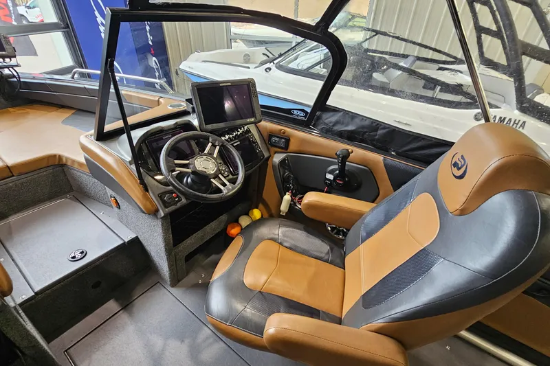 Slide: The Image of 2019 Princecraft Platinum SE 227 boat interior with steering wheel and control panel. - 13