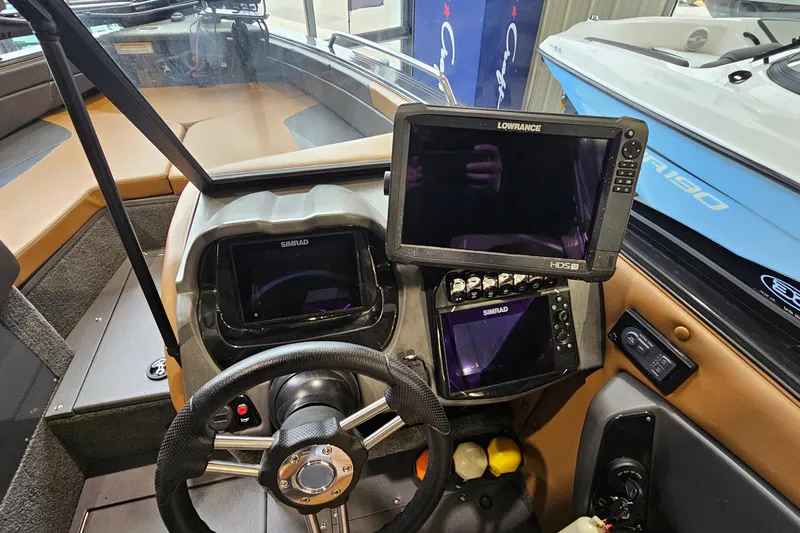 Slide: The Image of 2019 Princecraft Platinum SE 227 boat dashboard with Simrad and Lowrance displays. - 15