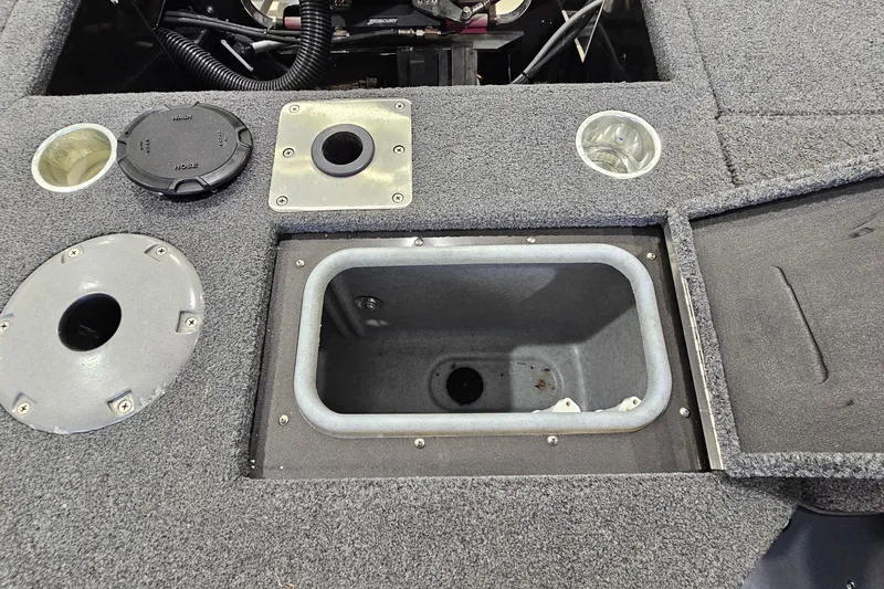 Slide: The Image of 2019 Princecraft Platinum SE 227 boat interior with storage compartments and utility features. - 20