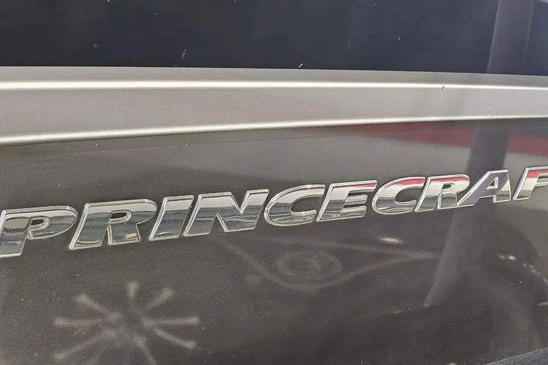 Slide: The Image of Princecraft Platinum SE 227 boat logo, 2019 model, metallic lettering on dark surface. - 23