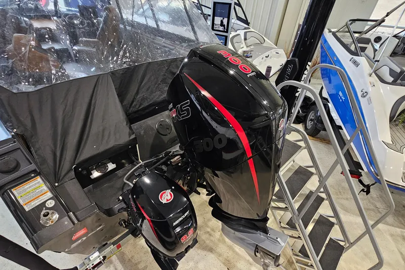 Slide: The Image of 2019 Princecraft Platinum SE 227 boat with powerful Mercury outboard motor in showroom. - 4