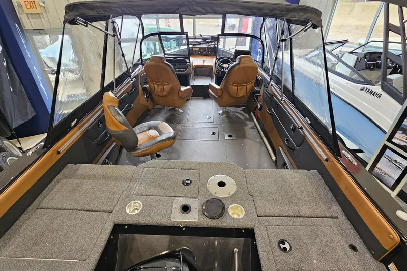 Slide: The Image of 2019 Princecraft Platinum SE 227 boat interior with seating and dashboard view. - 8