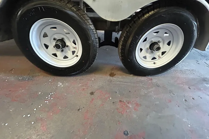Slide: The Image of Dual wheels of a 2016 Berkshire STS Salt edition trailer on a concrete floor. - 11