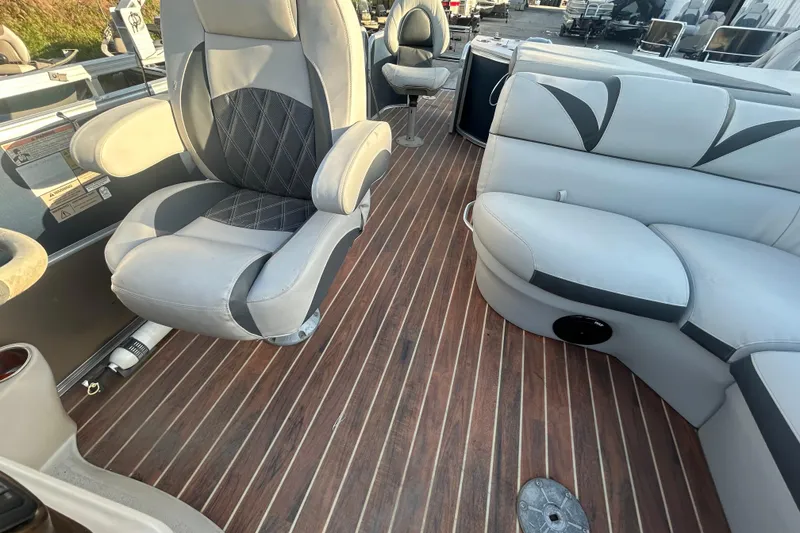 Slide: The Image of Interior of a 2016 Berkshire STS Salt edition boat with plush seating and wood flooring. - 18