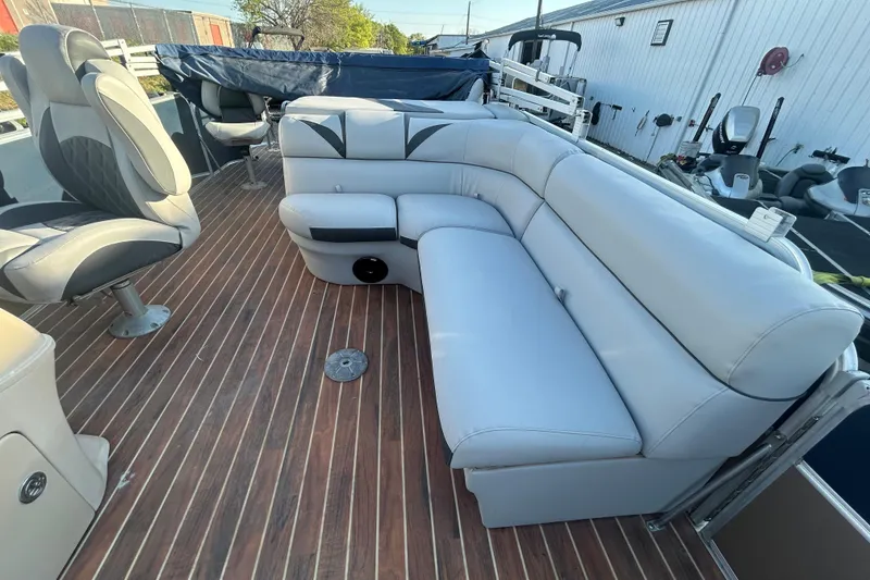 Slide: The Image of 2016 Berkshire STS Salt edition boat interior with plush seating and wood-style flooring. - 21