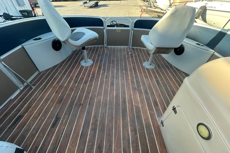 Slide: The Image of Interior of 2016 Berkshire STS Salt edition boat with wooden flooring and swivel seats. - 22