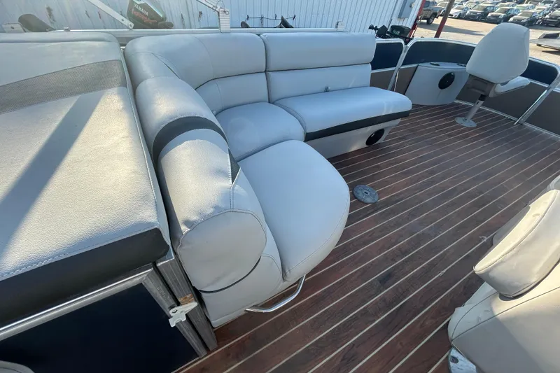 Slide: The Image of 2016 Berkshire STS Salt edition boat interior with plush seating and wooden flooring. - 23