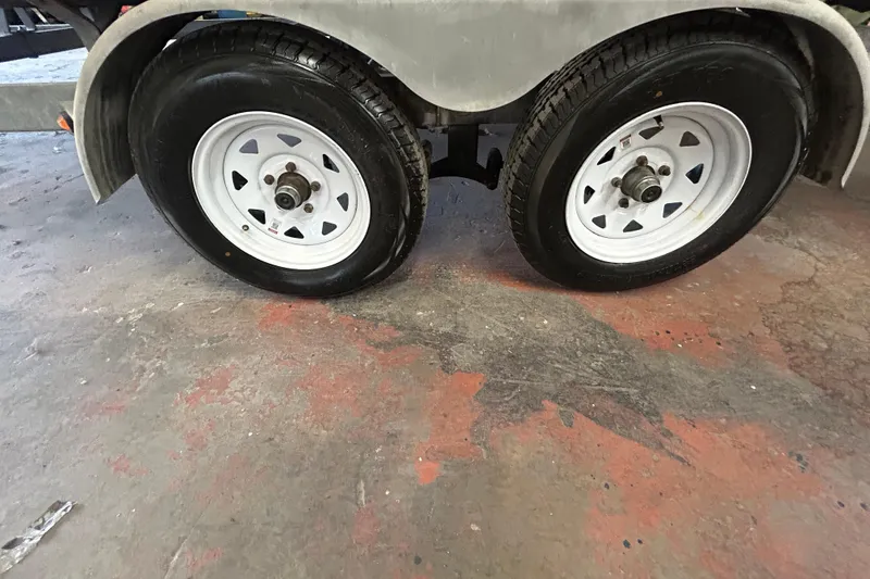 Slide: The Image of 2016 Berkshire STS Salt edition trailer wheels on a concrete floor. - 27