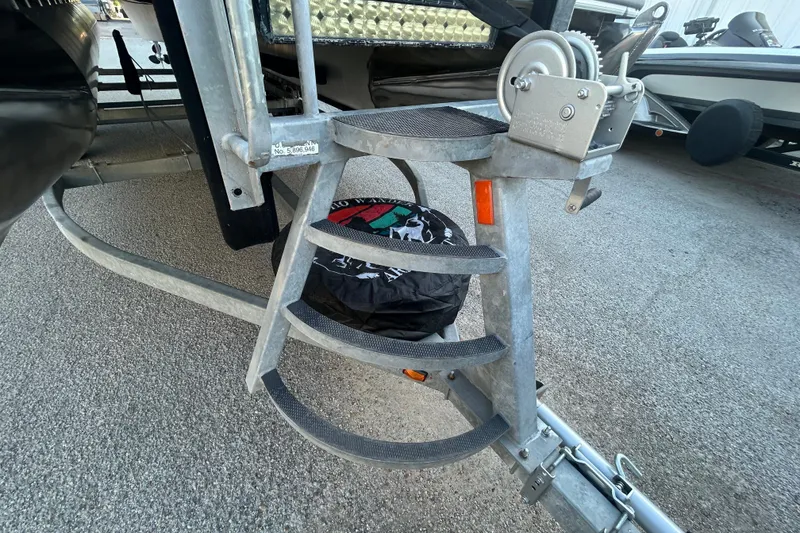 Slide: The Image of Trailer winch and steps on a 2016 Berkshire STS Salt edition boat. - 31