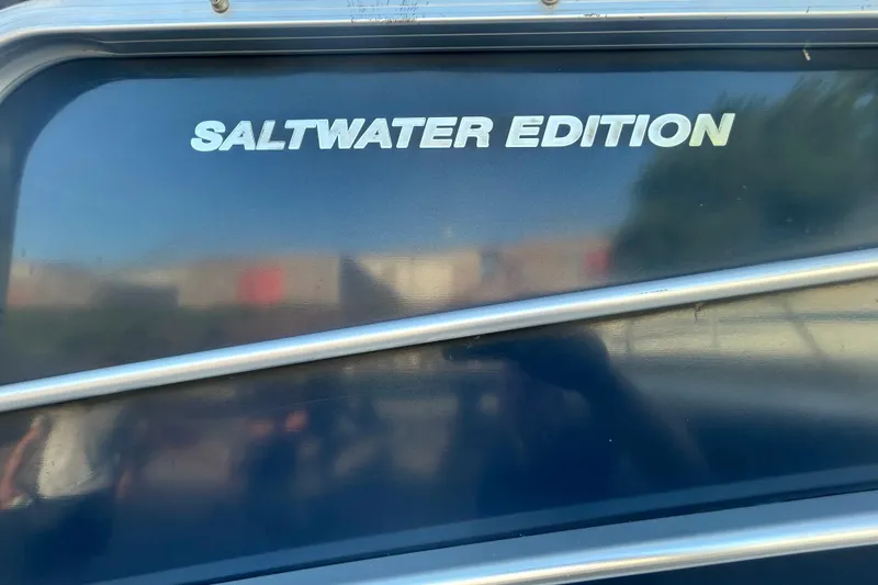 Slide: The Image of 2016 Berkshire STS Saltwater Edition boat with sleek design and metallic accents. - 32