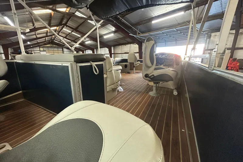 Slide: The Image of Interior of a 2016 Berkshire STS Salt edition boat in a warehouse setting. - 4