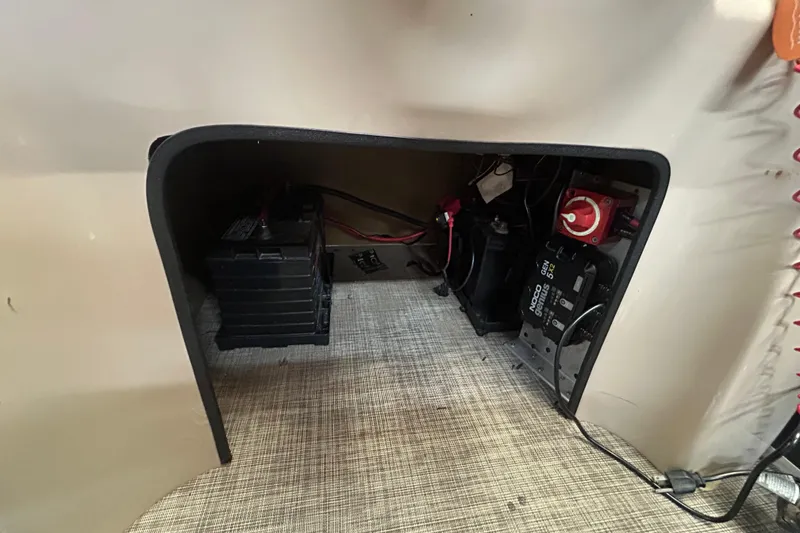 Slide: The Image of 2018 SunCatcher V20 Fish battery compartment with wiring and switch panel. - 20