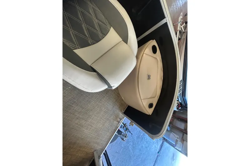 Slide: The Image of 2018 SunCatcher V20 Fish boat interior with seating and storage compartments. - 23