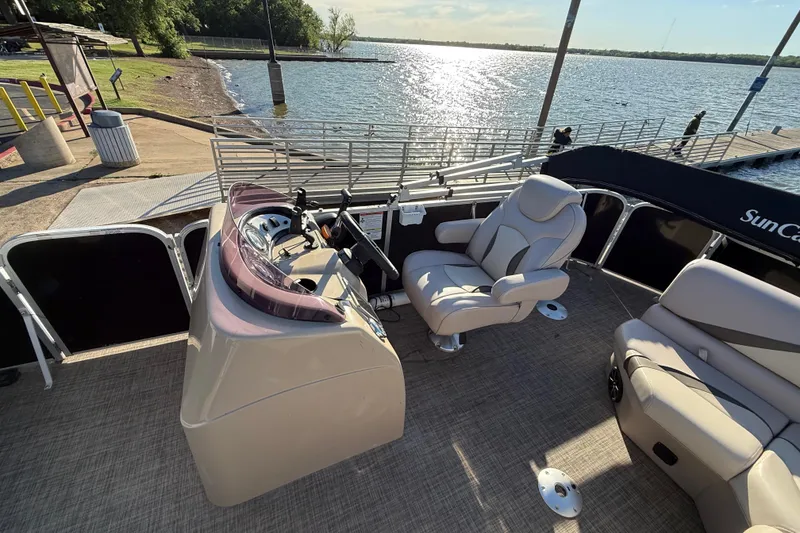Slide: The Image of 2018 SunCatcher V20 Fish boat interior with steering console and comfortable seating by the lake. - 34