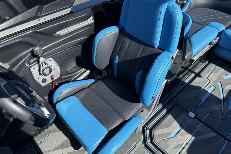 Slide: The Image of 2021 Supra SA 450 interior with blue and black seating, modern design. - 13