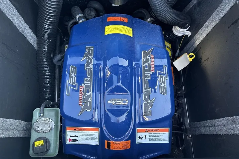 Slide: The Image of 2021 Supra SA 450 engine, Raptor Indmar 6.2L, blue cover, warning labels visible. - 20