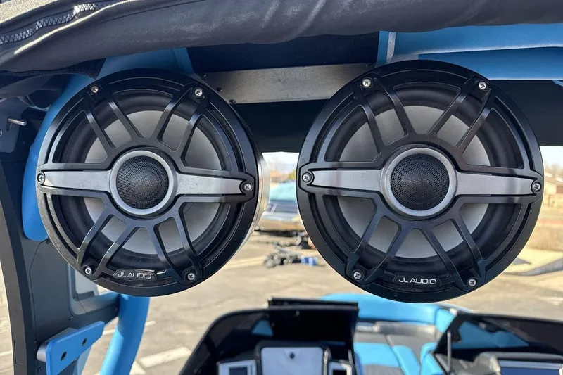 Slide: The Image of Dual JL Audio speakers on a 2021 Supra SA 450 boat, showcasing premium sound system. - 21