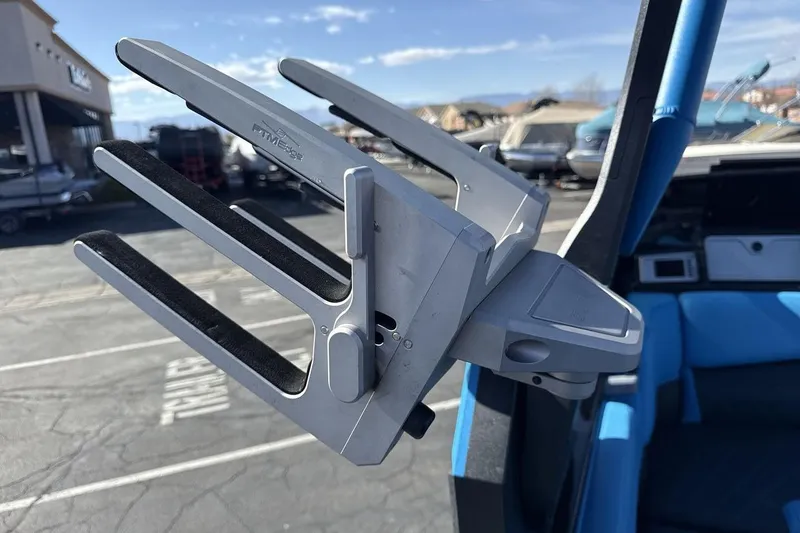 Slide: The Image of Wakeboard rack on a 2021 Supra SA 450 boat, parked outdoors. - 22