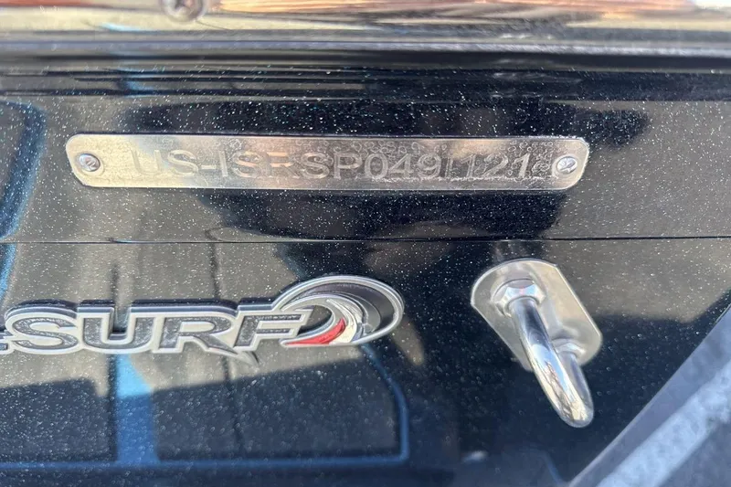 Slide: The Image of 2021 Supra SA 450 boat with identification plate and SURF logo. - 28