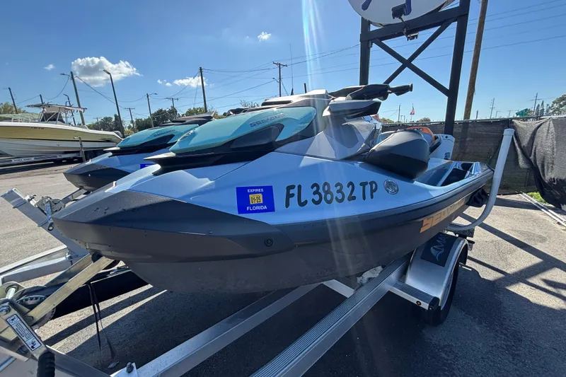 Slide: The Image of 2023 Sea-Doo GTI 130 jet ski on trailer, Florida registration visible. - 11