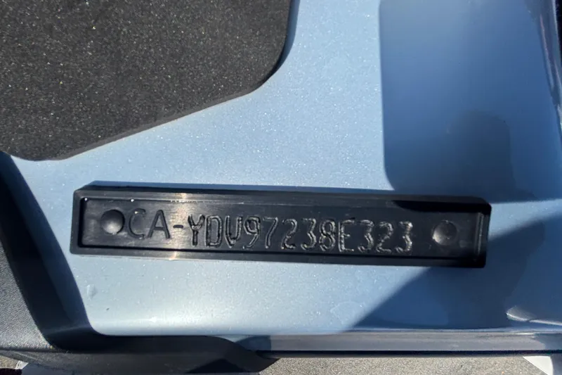 Slide: The Image of 2023 Sea-Doo GTI 130 hull identification number on blue surface. - 14