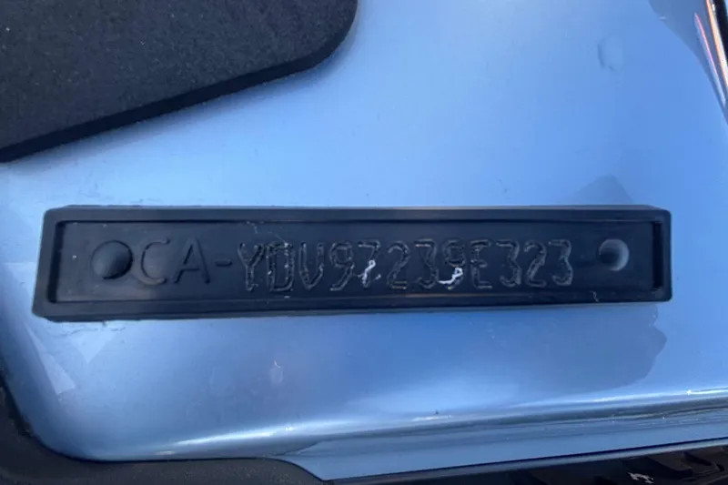 Slide: The Image of 2023 Sea-Doo GTI 130 hull identification number on a blue surface. - 15