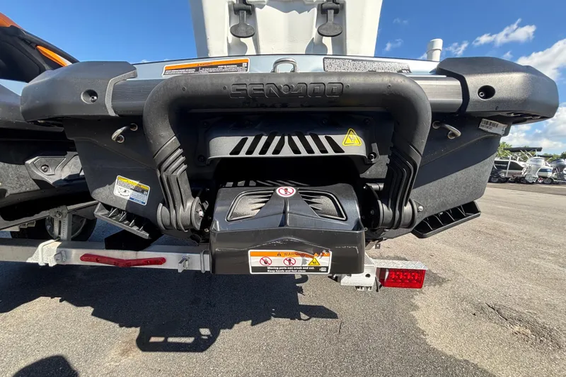 Slide: The Image of 2023 Sea-Doo GTI 130 rear view, showcasing engine and exhaust system details. - 17