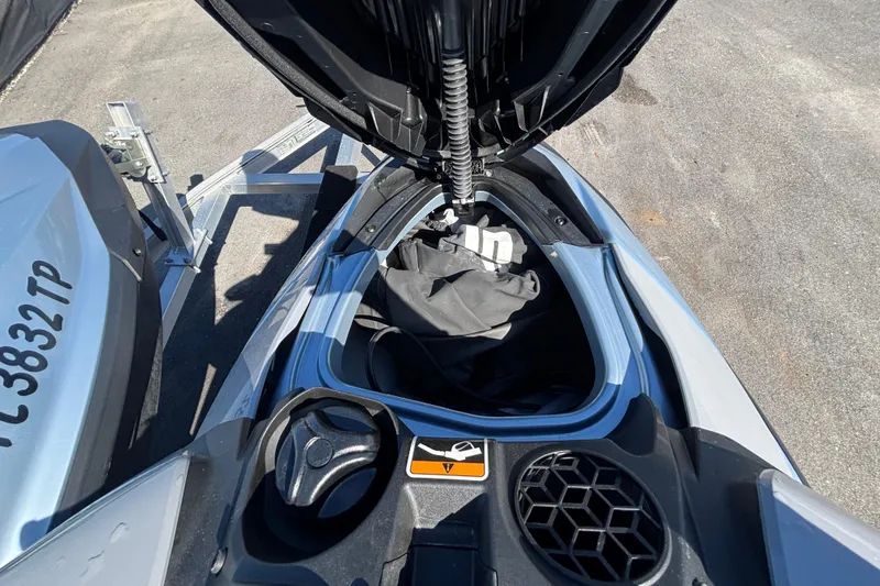 Slide: The Image of 2023 Sea-Doo GTI 130 with open storage compartment, showcasing interior space and design. - 29