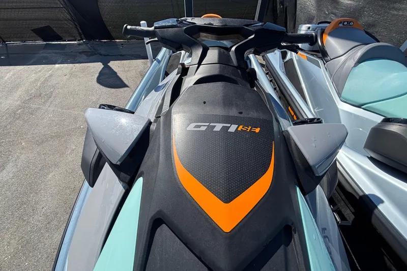 Slide: The Image of 2023 Sea-Doo GTI 130 jet ski with sleek design and orange accents. - 32