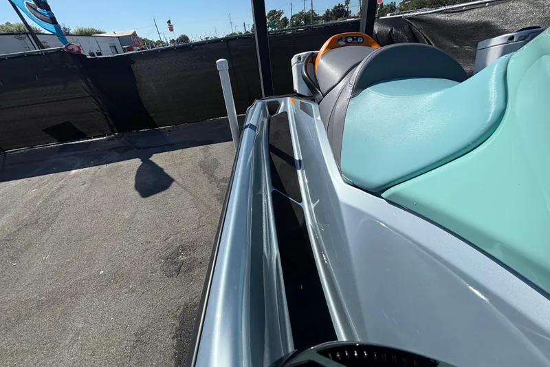 Slide: The Image of 2023 Sea-Doo GTI 130 jet ski with teal seat and sleek design. - 34