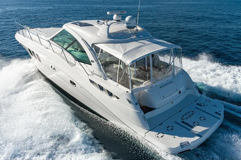 Slide: The Image of 2005 Sea Ray 480 Sundancer yacht cruising on open sea. - 11