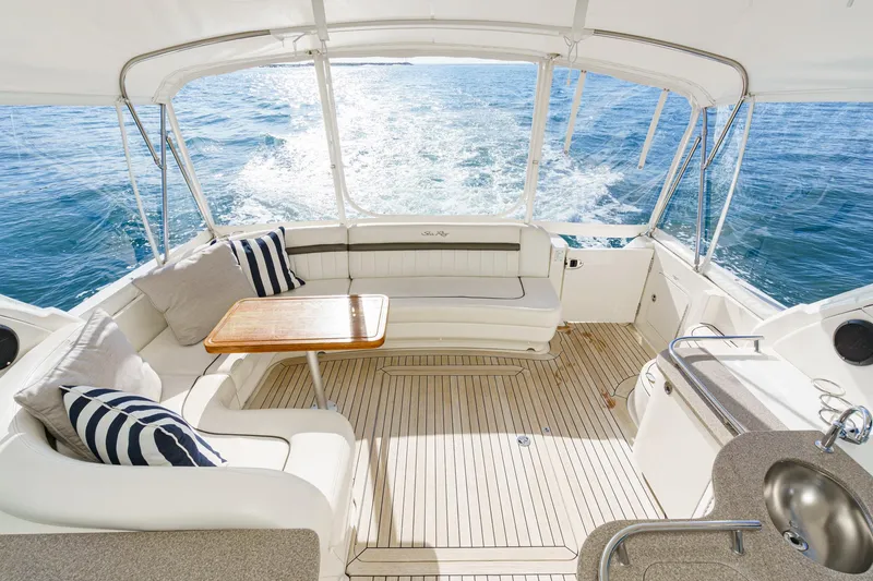 Slide: The Image of Interior of a 2005 Sea Ray 480 Sundancer yacht on the water. - 24