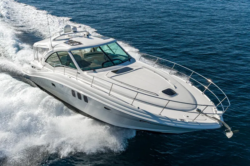 Slide: The Image of 2005 Sea Ray 480 Sundancer yacht cruising on open sea. - 3