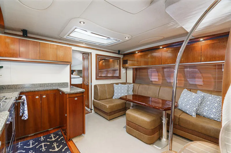Slide: The Image of Interior of 2005 Sea Ray 480 Sundancer with elegant wood finish. - 42