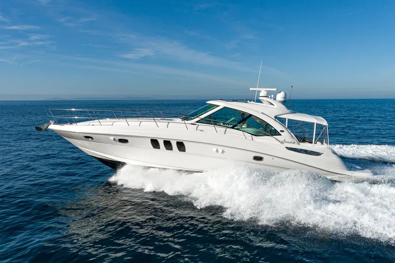 Slide: The Image of 2005 Sea Ray 480 Sundancer yacht cruising on open sea. - 8